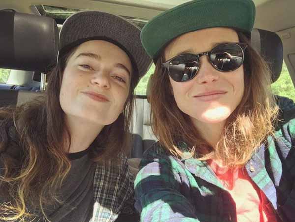Ellen Page and Emma Portner taking a picture together.